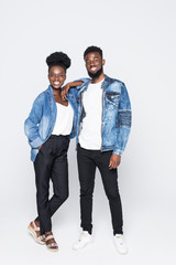 African young couple standing on white background