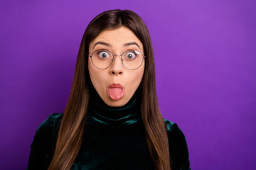 Close up photo of cute lady making faces wearing black turtleneck isolated over purple violet background