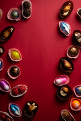 Chocolate Candy set on red background and copy space