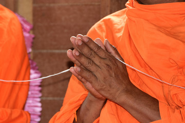 Monks' hands praying on ceremony of buddhist, Thailand