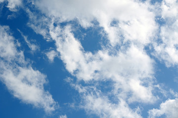 fluffy cumulus clouds and blue sky
