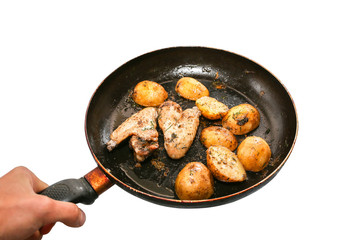 Chicken wings with potatoes isolated on white background. Homemade lunch. Unhealthy food photo with fat.