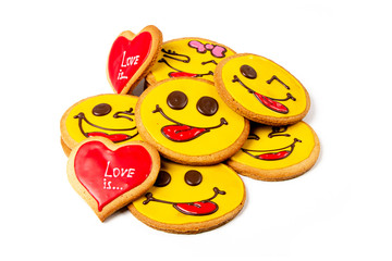 Group of yellow smiley and red heart cookies isolated on white background