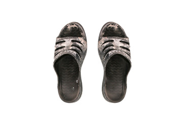 Dirty old rubber flip-flops isolated on white background.