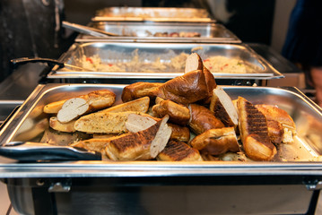 Pile of buttered garlic bread ready to serve to your plate from the buffet.