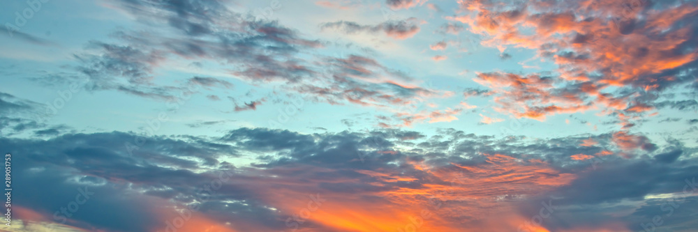 Wall mural blue and orange sky with clouds, panoramic background