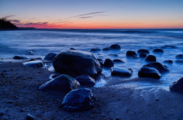 Twilight on the coast of the Baltic Sea, stones and a long exposure.