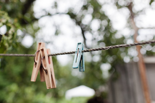  Colorful plastic clothespins on the hangers with blurred background