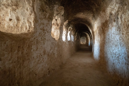 Inside the caves of Takht-e Rostam ancient buddhist stupa-monastery in Samangan, Afghanistan in August 2019