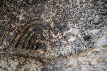 Inside the caves of Takht-e Rostam ancient buddhist stupa-monastery in Samangan, Afghanistan in August 2019