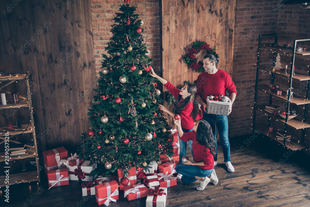 Sticker Above high angle full length body size view of three nice attractive cheerful glad family mom dad decorating fir fairy december winter vacation in industrial loft wood brick style interior indoors