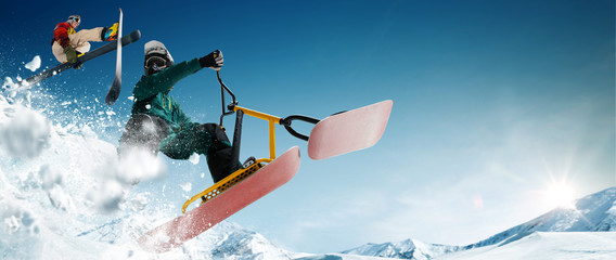 Skiing, snow scoot, snowboarding.  Extreme winter sports.