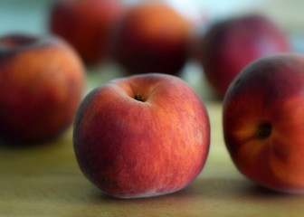 Fototapeta na wymiar peaches on wooden table