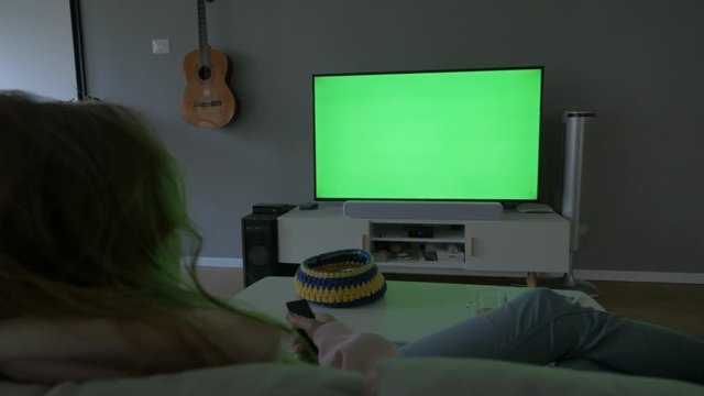 Women Watching TV at Her Home, Green Screen Replace