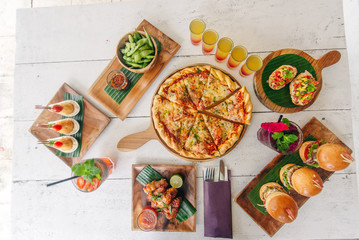 assortment on the table pizza burgers