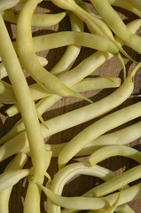 Yellow string beans (green beans)  on a wooden board  .nutrition. food. eco-products in farm. Organic. Vegetarian. Health life