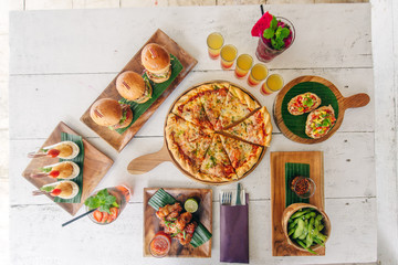assortment on the table pizza burgers