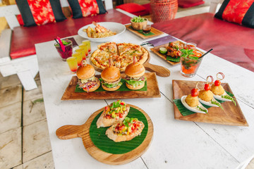 assortment on the table pizza burgers