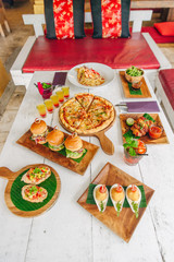 assortment on the table pizza burgers