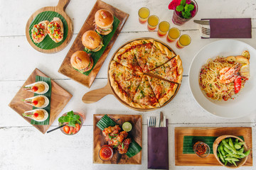 assortment on the table pizza burgers