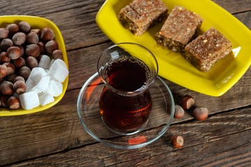 Fragrant black tea in a glass and with Shaki halva