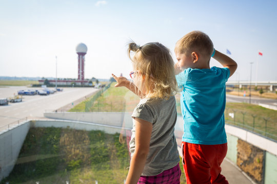 Little boy and girl waiting for boarding on the airport