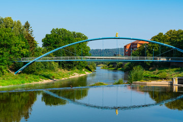 Blue metal bridge with rat, over river Weser. Hameln, Germany