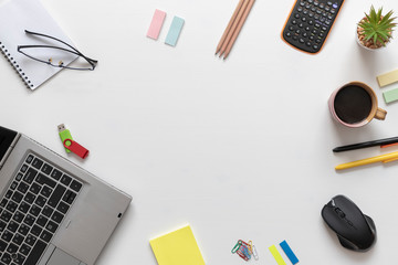 Modern white office desk table with laptop computer