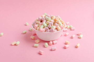 marshmallow in bowl on pink background