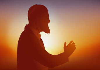 Symbole de la religion judaïque avec un Rabbin qui prie et prêche devant ses fidèles en portant un habit traditionnel.