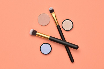 Fashion cosmetic makeup autumn Set. Minimal. Beauty product on coral background. Trendy accessories...