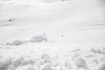 Fototapeta na wymiar A skier alone on a ski slope