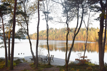 Outdoor furniture on pier overlooking a lake