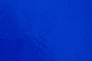 Beautiful closeup textures abstract color dark blue and purple tiles granite and dark blue glass pattern wall and background and art