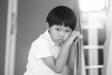 A Portrait of depressed Asian boy, black and white tone.