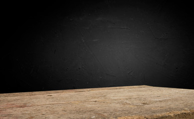 Empty wood table top on blur light gold bokeh of cafe restaurant in dark background