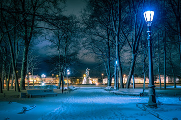 St. Petersburg in winter evening. Russia. Lanterns illuminate the evening city. A snow-covered path leads to the monument. Bronze horseman. Monument To Peter The Great. Unusual angle.