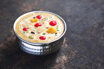 Thai soup with fresh vegetables. Creamy soup with tomatoes, manga, coconut milk