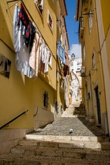 narrow street in lisbon portugal