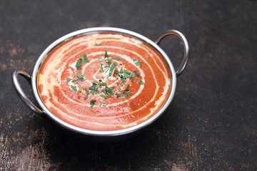 Indian tomato soup. Aromatic creamy tomato soup served with carol and coconut milk