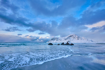 Fototapeta premium Norwegian Sea waves on rocky coast of Lofoten islands, Norway