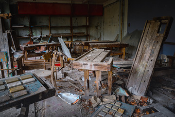Messy and abandoned classroom in ghost town
