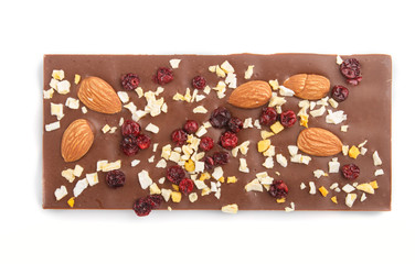 milk chocolate bar with almonds and dried fruits isolated on white background. top view