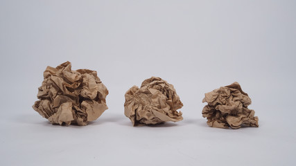 Crumpled brown paper.It is mauled on white background.