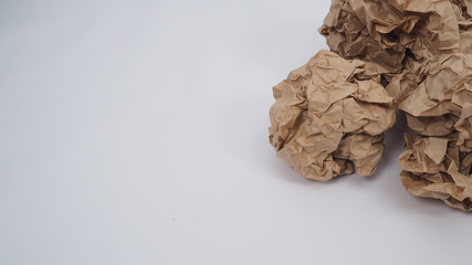Crumpled brown paper.It is mauled on white background.
