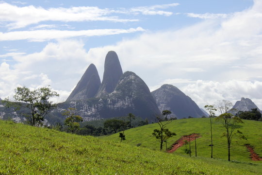 Rural scene in the municipality of Aguia Branca, Espirito Santo, Brazil, showing in the background the set of rocks known as three pontoons