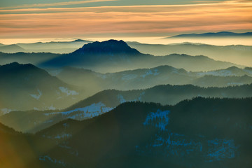 Aerial Landscape view from Ceahlău Mountains National Park at sunset in winter season,Sunset in Ceahlau Mountains