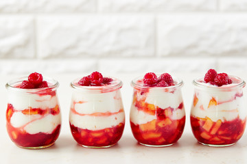Peach and raspberry dessert with yogurt cream