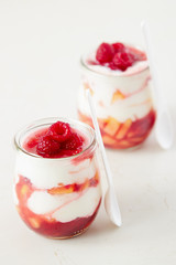 Peach and raspberry dessert with yogurt cream