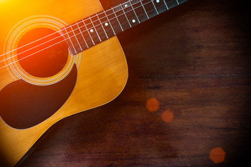 Fototapeta premium Close-up of of brown wooden acoustic classical guitar.